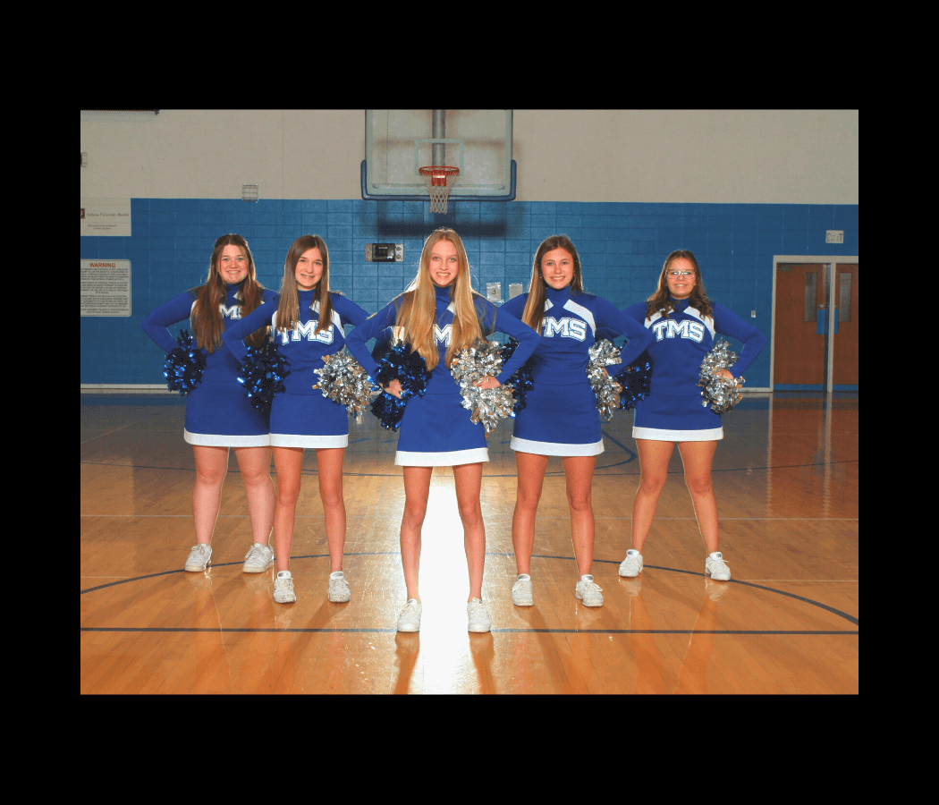 middle school cheerleaders strike a pose