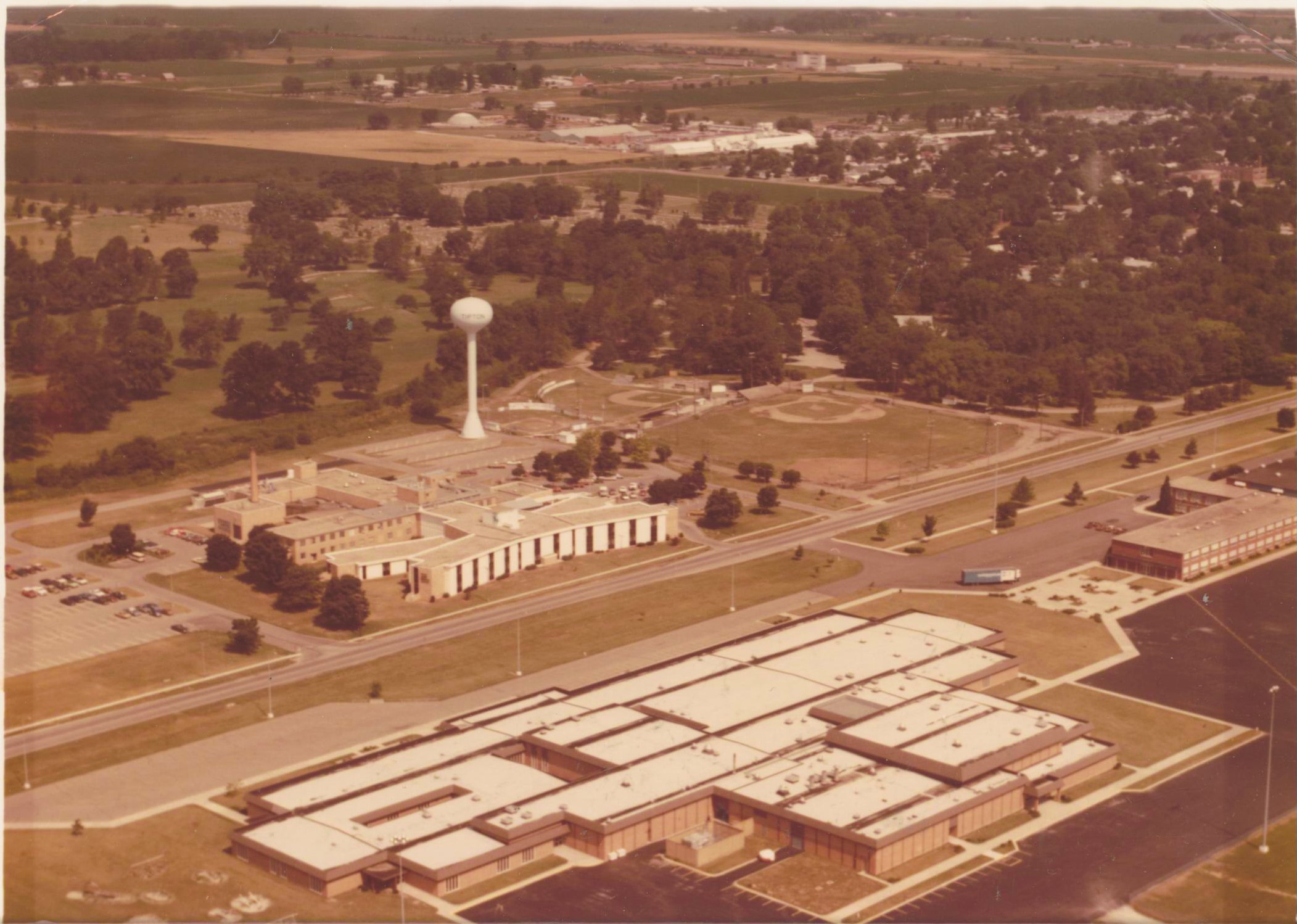 Sepia-tone, aerial view of Tipton Middle School and Washington Elementary School. Farmland is seen in the background.