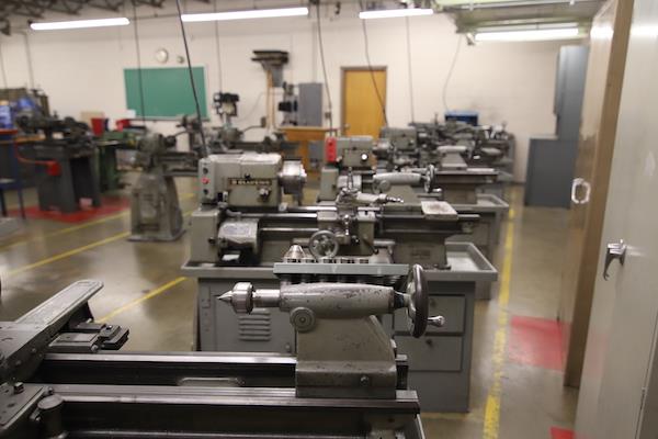 Frontal view of the row of machines in the metals lab