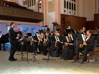 The jazz band, clad in all black, performs at DePauw at the annual Jazz Fest.