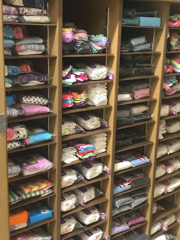 Shelves of socks and underwear, organized by size and style