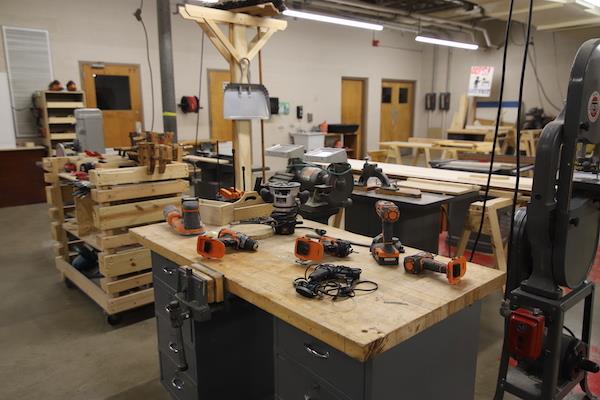 An assortment of handheld power tools for student use. 