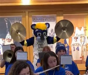 Pacers Mascot boomer, a blue cat, makes an appearance at the band's performance.
