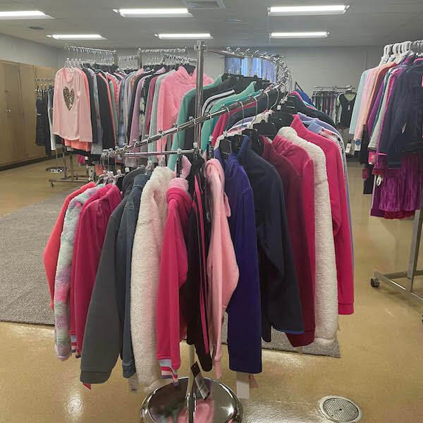 Rack of long-sleeved jackets in pinks and purples